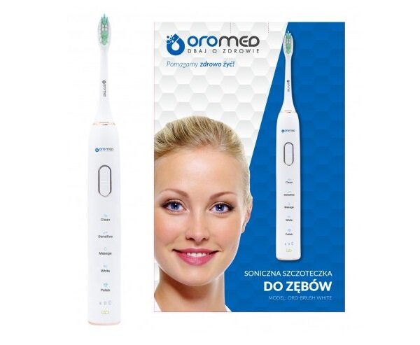 Szczoteczka do zębów Oromed Oro-Brush z przodu wraz z pudełkiem