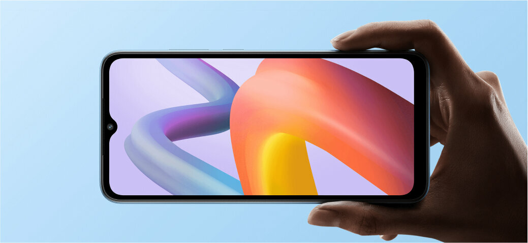 Smartfon Xiaomi Redmi A2 2/32GB czarny grafika przedstawiająca rękę trzymającą włączony smartfon z kolorowym wyświetlaczem na niebieskim tle