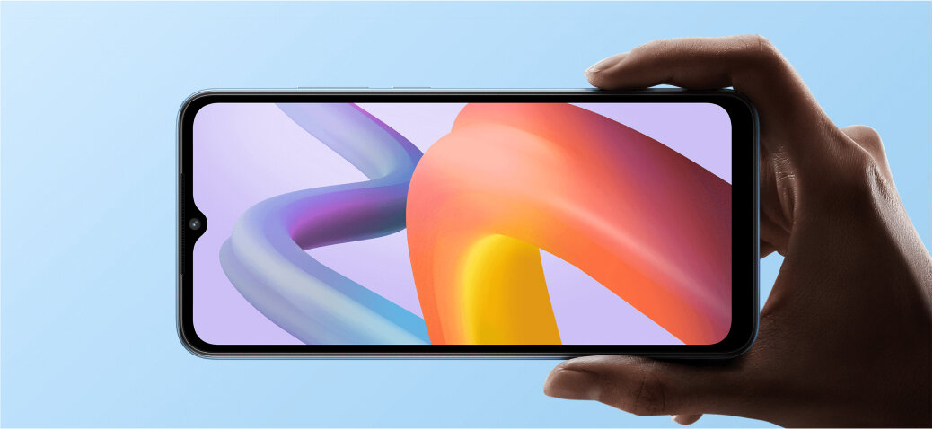 Smartfon Xiaomi Redmi A2 3/64GB czarny grafika przedstawiająca rękę trzymającą włączony smartfon z kolorowym wyświetlaczem na niebieskim tle