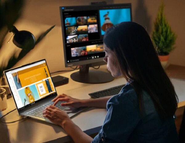 Laptop Lenovo ThinkPad X13 G1 grafika przedstawia kobietę siedzącą przy biurku i używającą laptopa