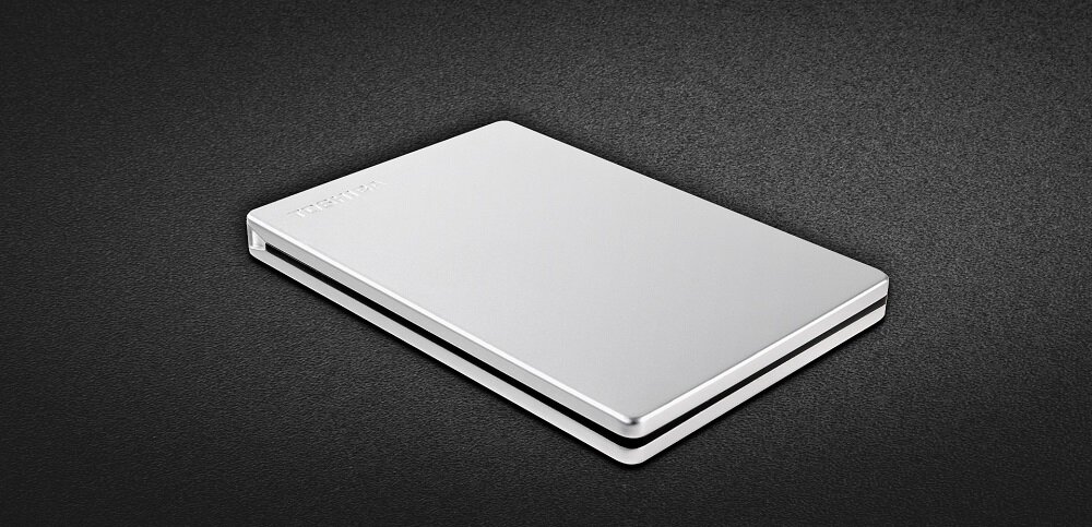 Dysk zewnętrzny Toshiba Canvio Slim 1TB srebrny widok dysku na szarym tle