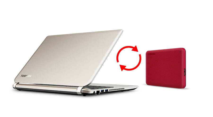 Dysk Toshiba Canvio Advance 1TB czerwony HDTCA10ER3AA dysk obok laptopa