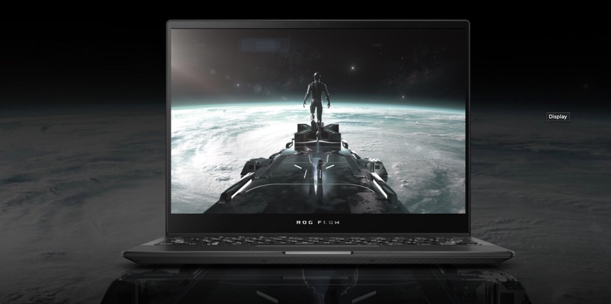Laptop Asus ROG Flow X13 GV301 Ryzen™ 9 5980HS/ 32 GB/ 1 TB otwarty na ciemnym tle planety, na ekranie maszerujaca postac tez na tle planety