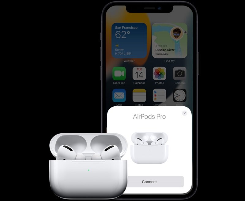 Słuchawki Apple AirPods Pro MLWK3ZM/A widok na smartfon iPhone oraz słuchawki w etui ładującym od przodu