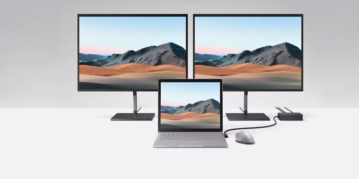 Stacja dokująca Microsoft Surface Dock 2 zdjęcie laptopa i dwóch monitorów podłączonych do stacji dokującej