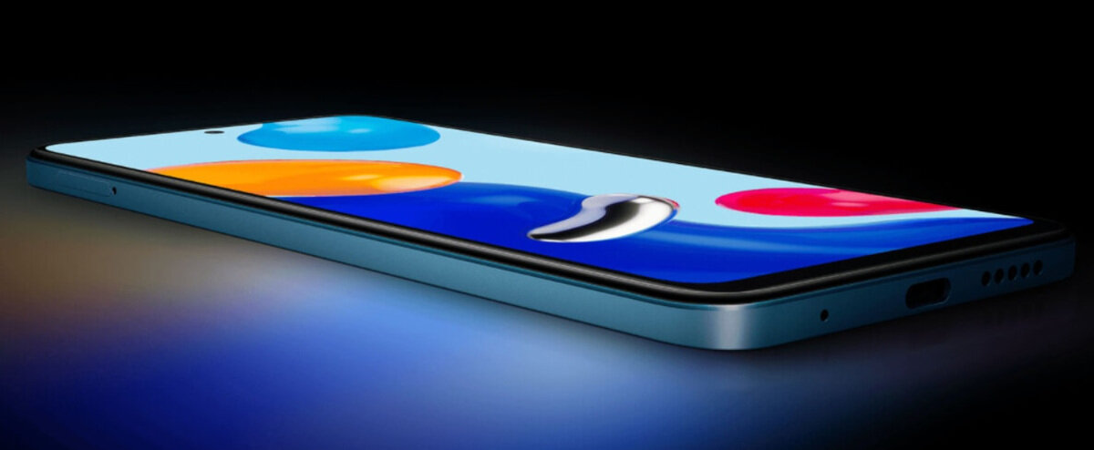 Smartfon Redmi Note 11 4/128 niebieski zmierzch pokazany położony telefon