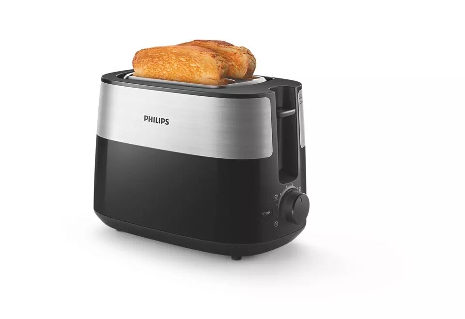 Toster Philips HD2516/90 widok na toster pod skosem z włożonymi do niego dwiema kromkami chleba