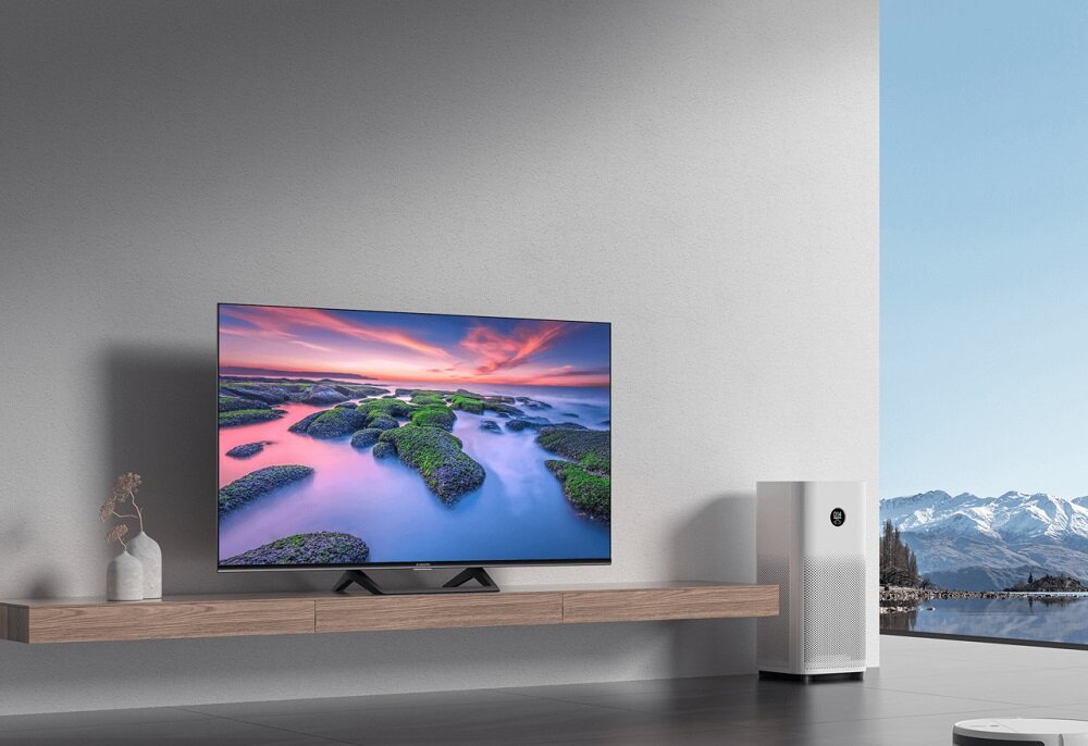 Telewizor Xiaomi Mi LED TV A2 pod skosem na szafce w salonie