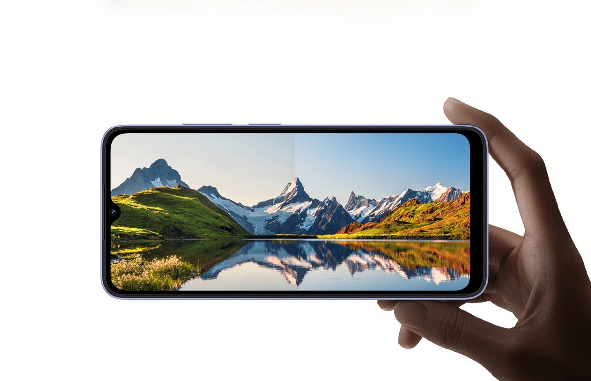 Smartfon Xiaomi Redmi 12C 4/128GB niebieski na białym tle ukazujący zdjęcie panoramy gór