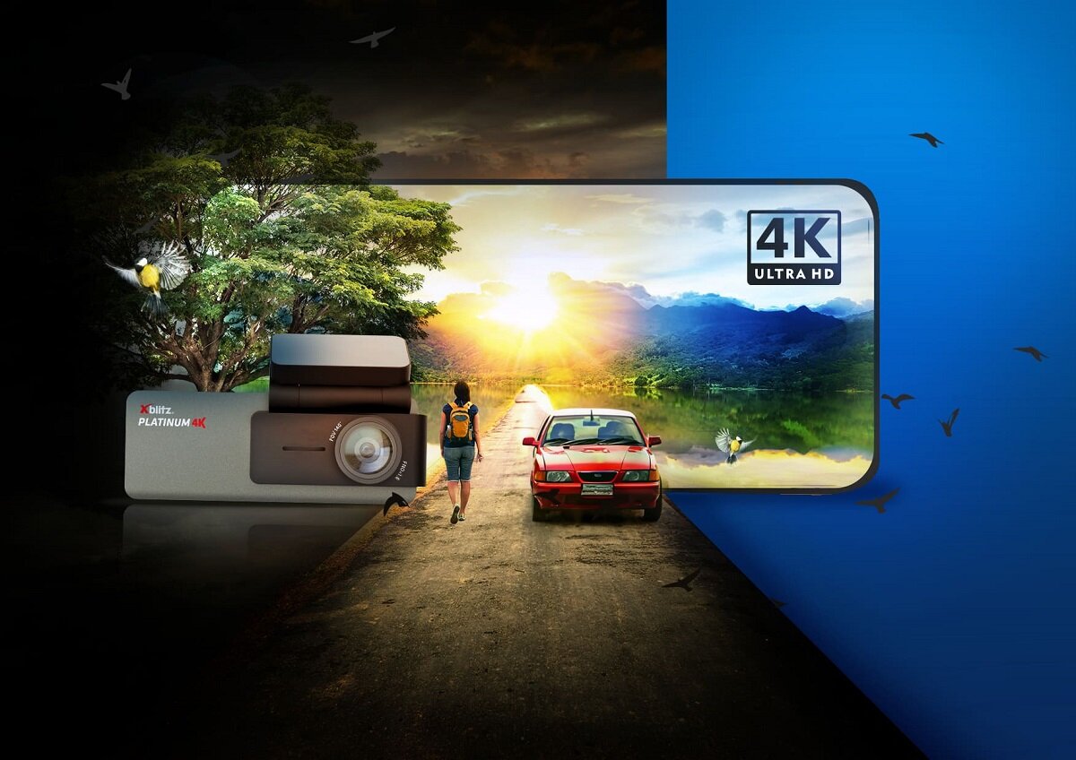 Wideorejestrator Xblitz Platinum 4K widok wideorejestratora, obok idący człowiek i jadący samochód na tle dzikiej przyrody