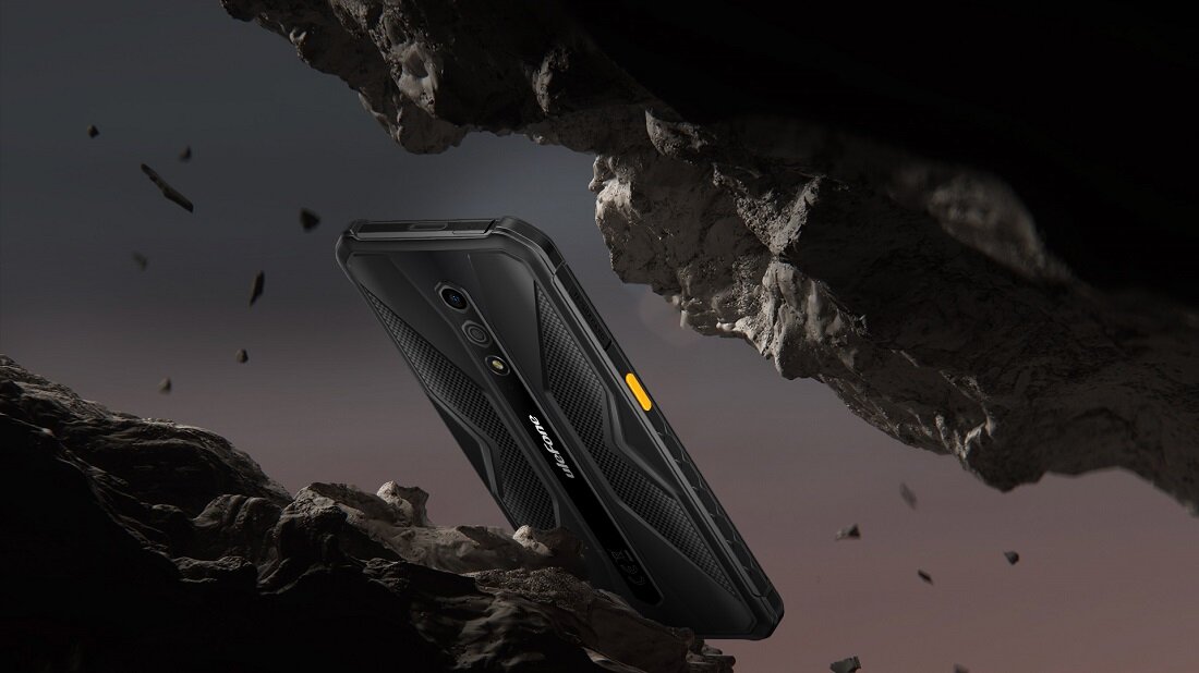 Smartfon Ulefone Armor X12 Pro 4GB/64GB czarno-pomarańczowy grafika przedstawia telefon między skałami