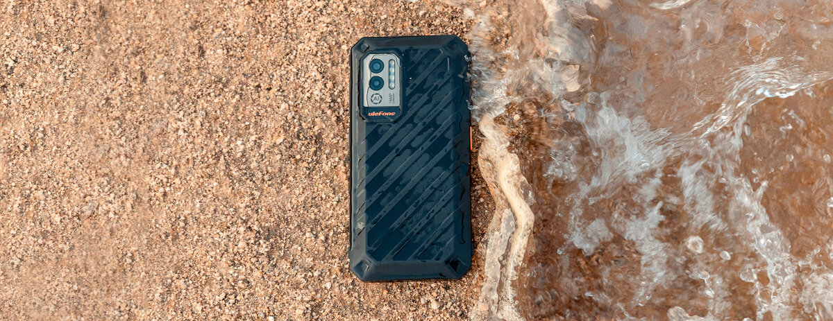 Smartfon Ulefone Power Armor X11 4GB/32GB czarny widok na telefon od przodu, położony płasko na piasku