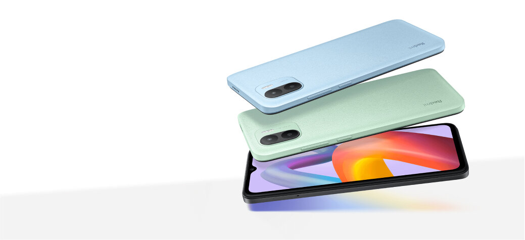 Smartfon Xiaomi Redmi A2 3+64GB zielony grafika przedstawiająca trzy smartfony, jeden z właczonym kolorowym wyświetlaczem oraz dwa tyłem nad nim po skosie na białym tle