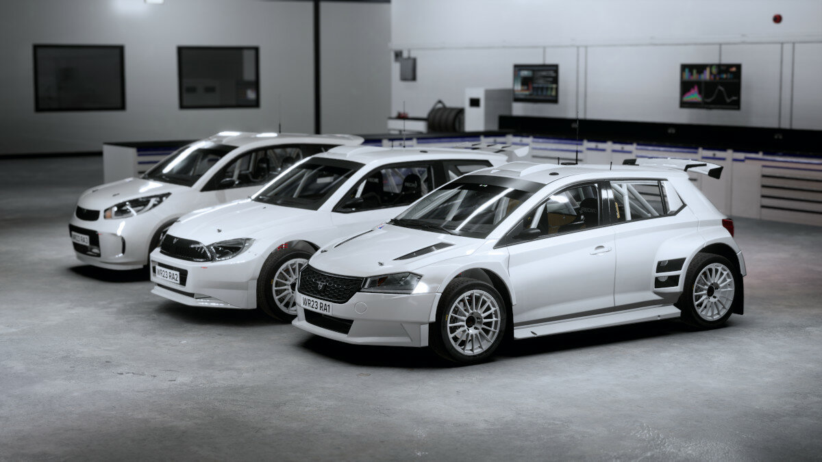 Gra Electronic Arts WRC kadr z gry ukazujący samochody stojące w garażu