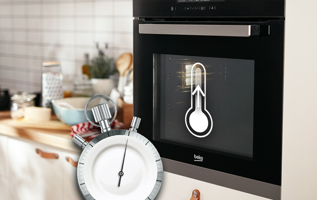 Kuchnia gazowo-elektryczna Beko FSE62120DX 60 cm widok na kuchenkę w zabudowie pod skosem, grafika z zegarkiem